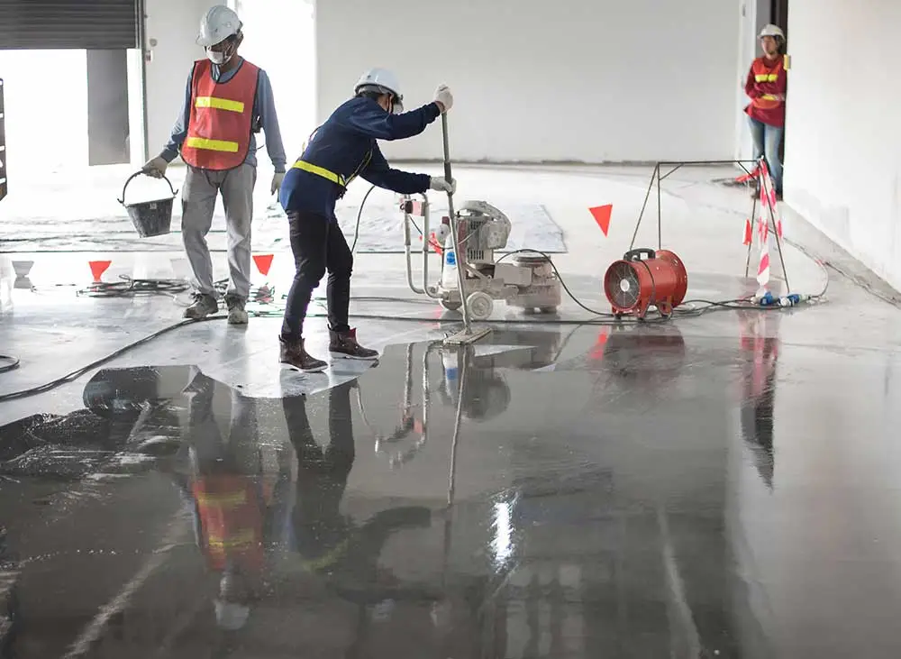 Workers are resurfacing the floor in Troy, NY.